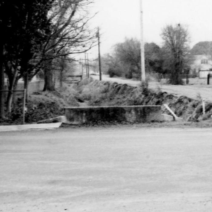 Dr. Leland F. Zatopek took this photograph at the intersection of Jackson Street with Live Oak and Eblin Streets in 1978 before Beef Head Ditch was covered. Photo courtesy of the Fayette Heritage Museum &amp; Archives