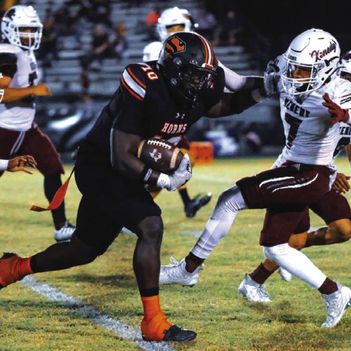 Tavondrick Ellison lays out a Kenedy defender on a run downfi eld. Photo by Andy Behlen