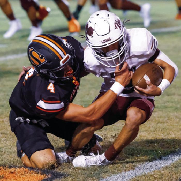 Jayse Janda brings down Kenedy running back Karson Reyes. Photo by Andy Behlen