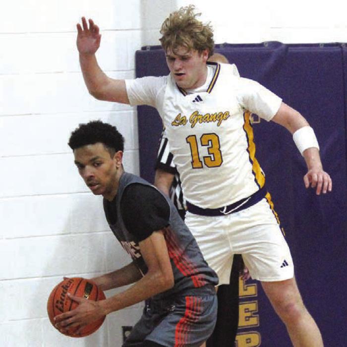 La Grange’s Conner Brooks plays defense against Gonzales in Tuesday’s game. Photo by Jeff Wick