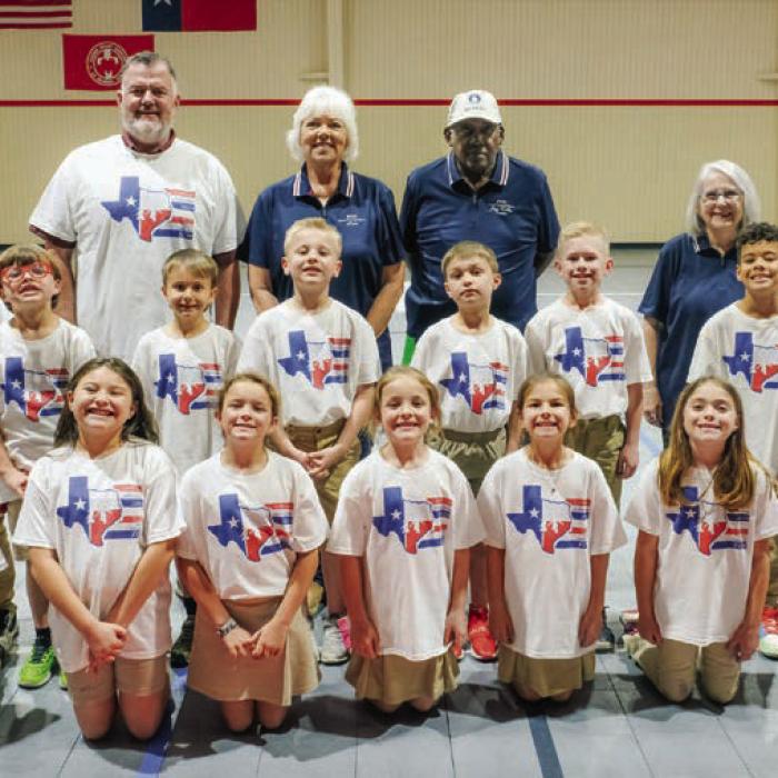Fifteen second graders at Sacred Heart competed in the Fayette County Helpers jumpathon contest. They are pictured with (back, from left) P.E. Coach David Wicke, and FCH organizers Lisa Hayes, Jeff Kelly and Karen Forest.