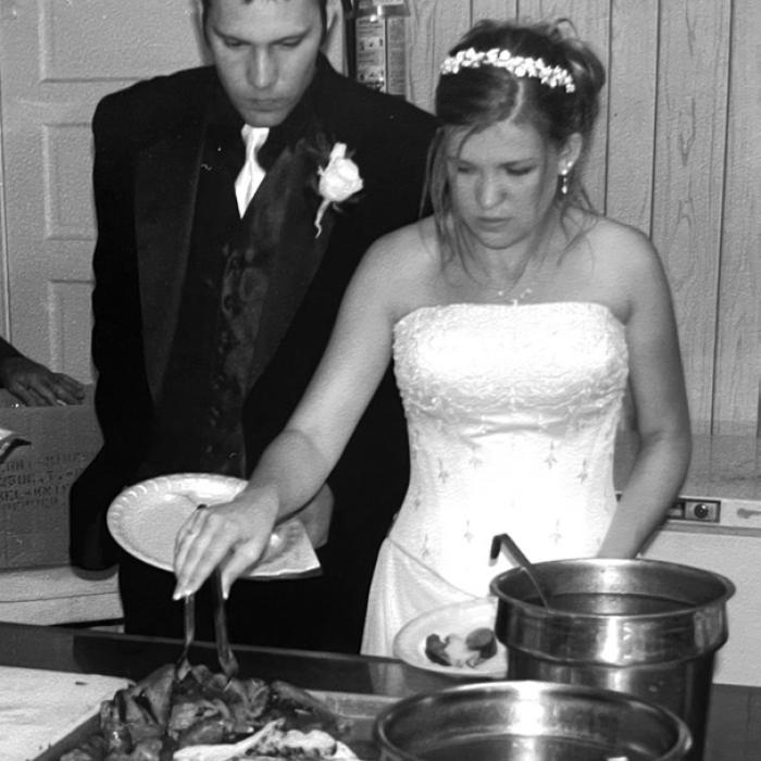 Jeff and Chrystal Wick dig into Mikeska’s barbecue 23 years ago at their wedding in High Hill.