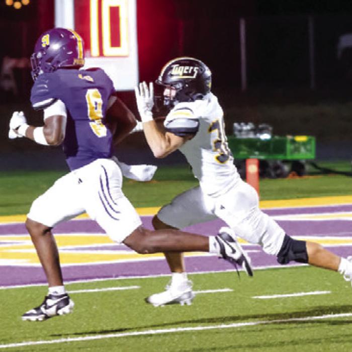 Dillan Johnson reaches the endzone on a touchdown reception in the first quarter. Photo by Andy Behlen
