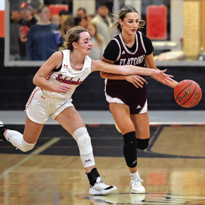 Summer Sodek advances downcourt with pressure from Schulenburg’s Miranda Bonner. The Flatonia Lady Bulldogs defeated The Schulenburg Lady Shorthorns 80-47 on Tuesday night in Schulenburg. Photo by Stephanie Steinhauser