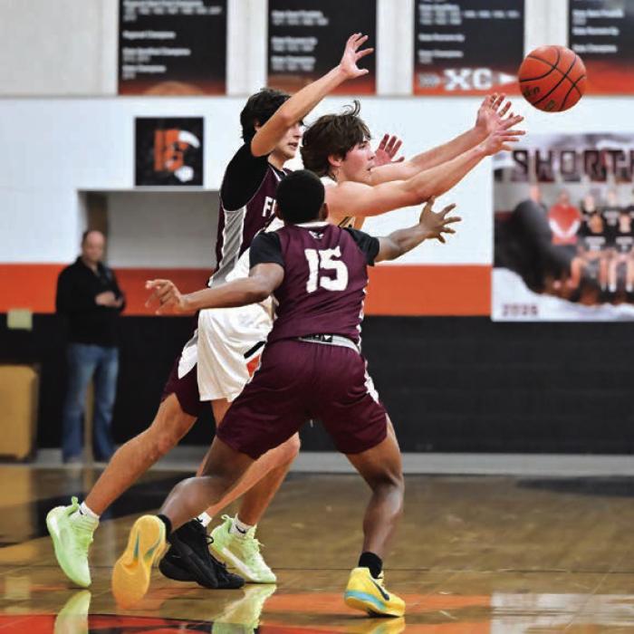 Schulenburg’s Jayse Janda gets a pass off with Flatonia defense closing in Tuesday. Photo by Stephanie Steinhauser