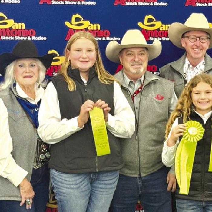 7th Place Team: Pictured with San Antonio Livestock Show and Rodeo Representatives, Center holding ribbon, Zoey Krenek and Catelyn Bosl. Not pictured is Abraham McBride and Abigale McBride.
