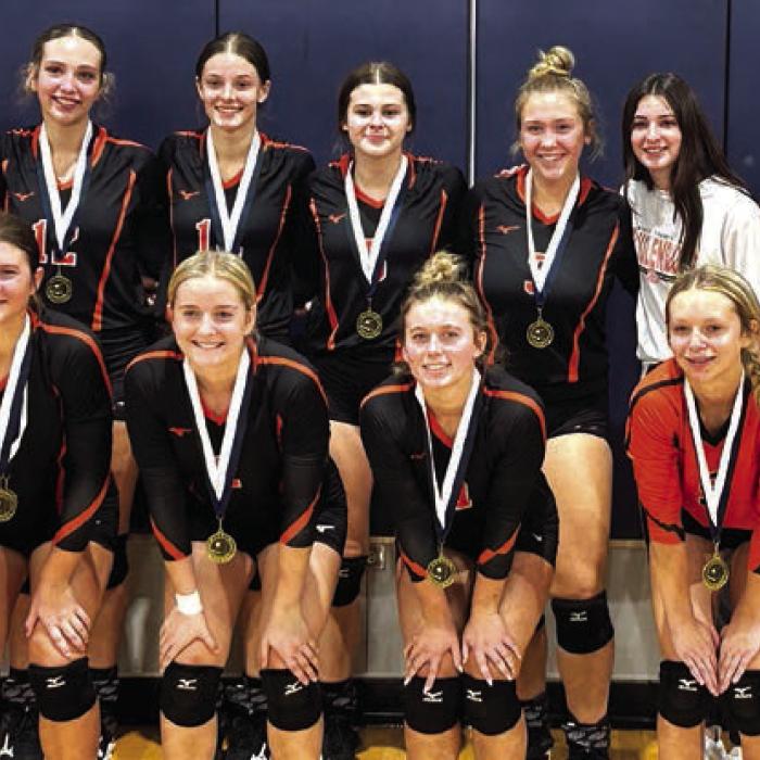 The members of the Schulenburg volleyball team pose with their medals after winning the championship in the Silver Bracket at the Goliad Tournament.