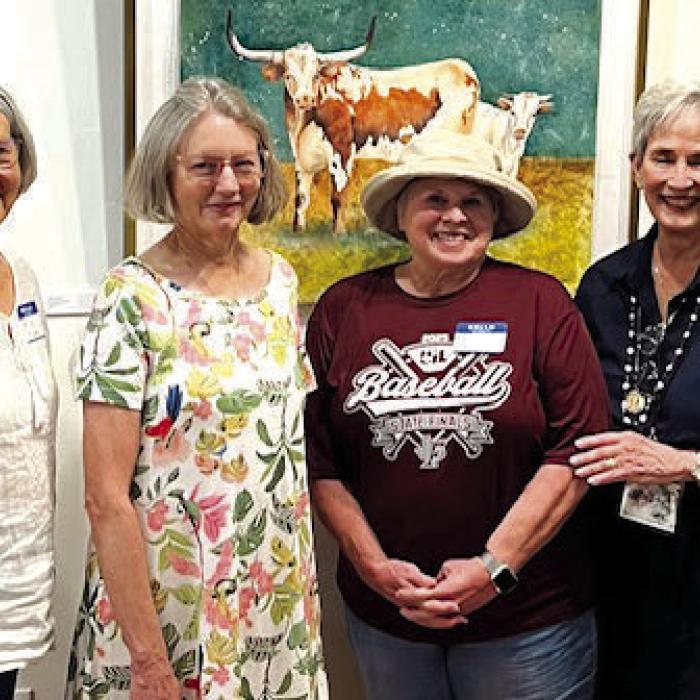 Art show participants from left: Darcia Mucha, Martha Dennis, Kathy Sauer, and Mary Quiros in front of longhorn painting by Kathy Sauer (not pictured Kathy Callaway).