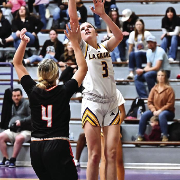 La Grange’s Kylie Trlicek, left, and Avery Griffin, right, got up for shots in last Friday’s district game against Smithville. Photos by Stephanie Steinhauser