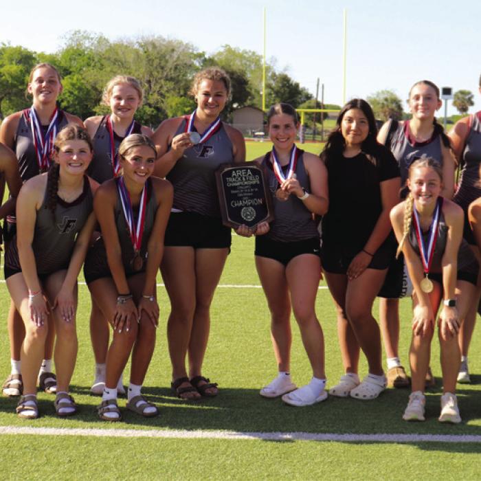 The Fayetteville girls track athletes pose with their Area championship plaque. Photos by Ann Pape