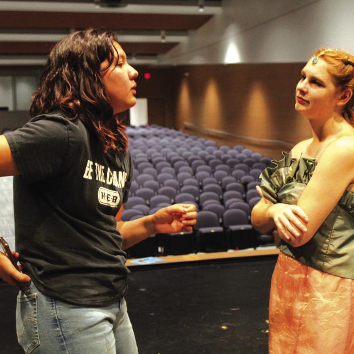 Bryssa Rios, the play’s student director, speaks to Megan Pleger regarding costumes and instructions.