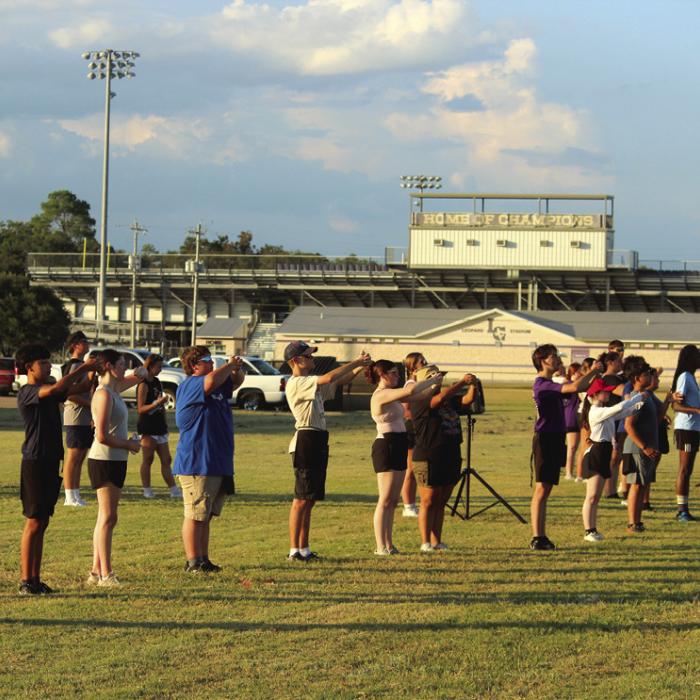 Friday Aug. 1 was the first day the band could begin working on their actual marching drill, so instead of holding their horns, the students were just learning their proper positions. “We start learning drill on August 1st per UIL rules. By that point, students need to have mastered the mechanics of marching and dance, should be able to play all of their music accurately, and should have 2-3 minutes of show music memorized,” said La Grange band director Christopher Cooper.