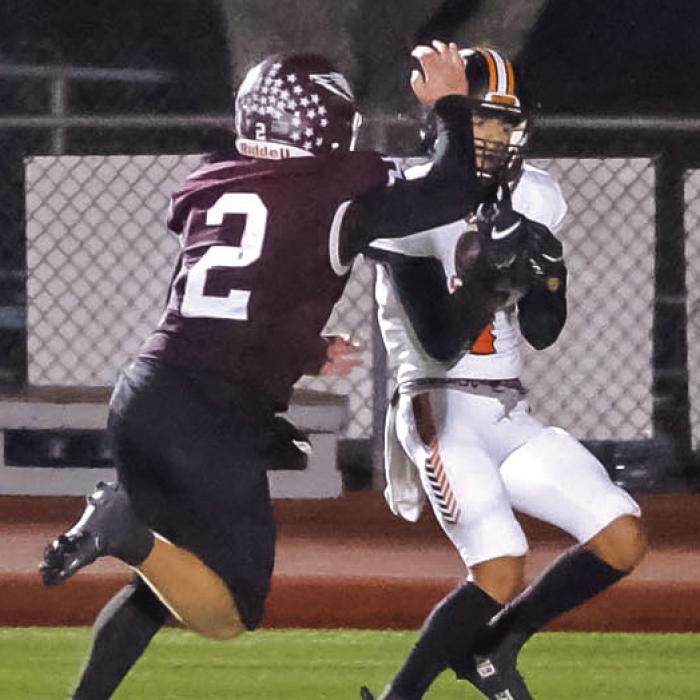 Jose Cortez catches a pass in the endzone to tie the game in the third quarter. Photos by Andy Behlen