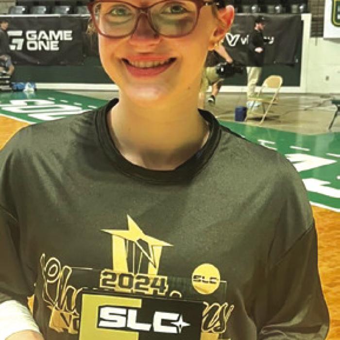 Fayetteville’s Brooklyn Jaeger is shown here holding her alltournament trophy and wearing a Southland Conference Tournament championship shirt and hat after Sunday’s victory.