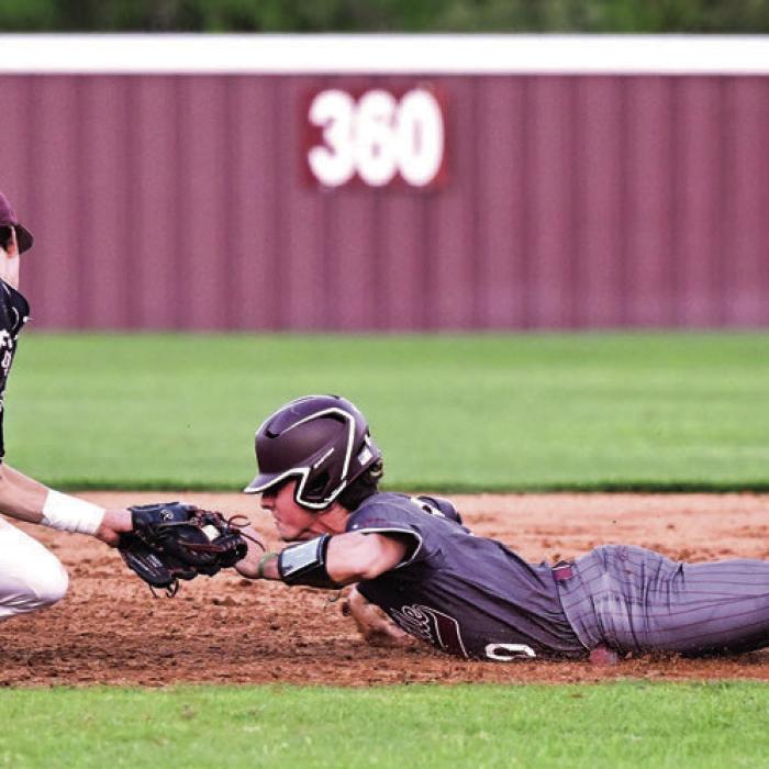 Flatonia’s Beck Zimmerman takes the throw from catcher Henri Vincik to stop Fayetteville’s Jack Winford from stealing second base. Photo by Stephanie Steinhauser