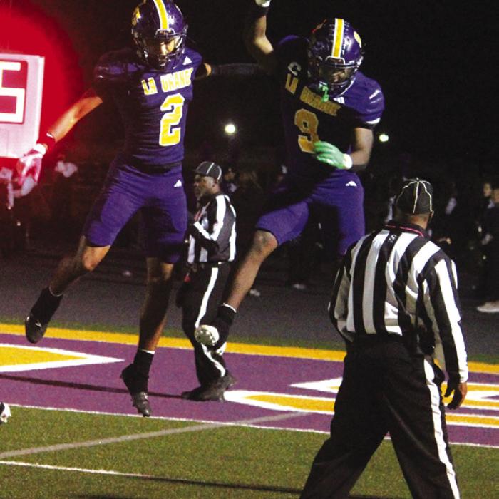 La Grange’s Dwodney Thompson, left, and Dillan Johnson, right celebrate after one of Thompson’s two touchdown catches in the second quarter. Photos by Jeff Wick