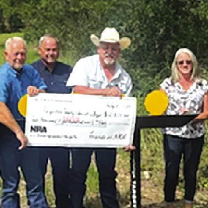 Pictured (from left) are Charlie Murray, Investigator Kenn Kretz, John Salem, Dennis Brower, Craig Schulz, Sheriff Keith Korenek, Lazy Q Manager Lori Gray, Sgt. Ron Naumann and Lt. David Beyer.