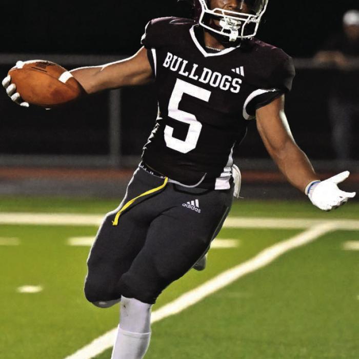 Flatonia’s Koren Scott celebrates a touchdown in the Bulldogs’ 44-0 win over Louise Friday. Photo by Stephanie Steinhauser