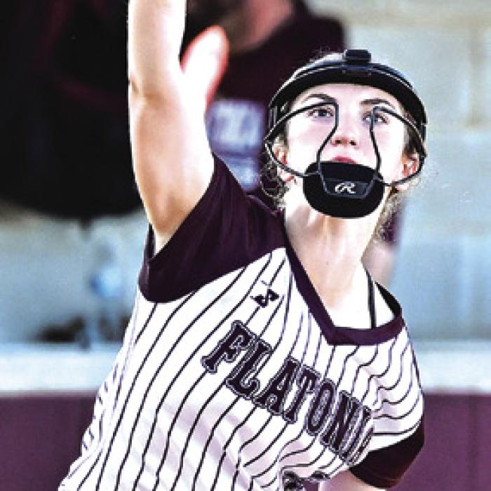 Emma Kosler throws to first base in last week’s game against Weimar. Photo by Stephanie Steinhauser