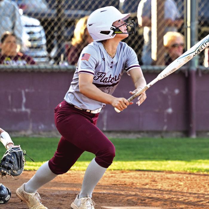 Jalee Trussell watches her ball go over the centerfield fence Tuesday night in Flatonia. The Lady Bulldogs defeated The Louise Lady Hornets for a district win. Photo by Stephanie Steinhauser