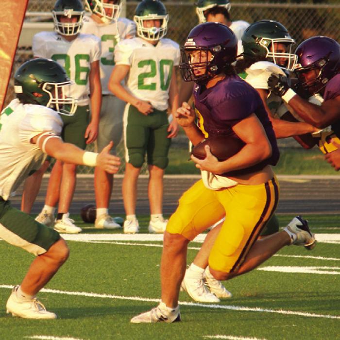 Left: La Grange quarterback Clayton Cooper scrambles for yardage in last week’s scrimmage against Franklin. Photo by Jeff Wick