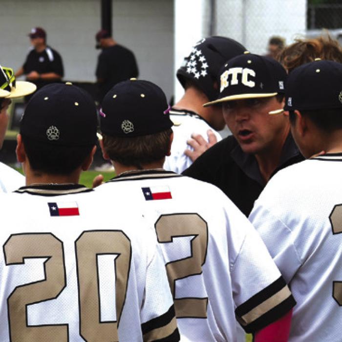Round Top-Carmine Baseball coach Ben Ahrens talks to his team during the game last week against Iola. Photo by Paul Kipp