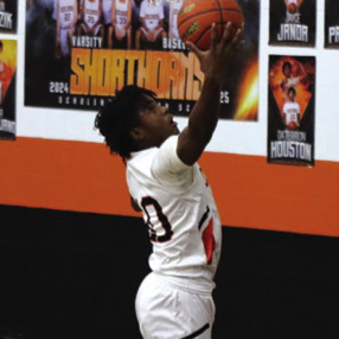 Daterrion Houston goes up for a basket in Friday’s 48-38 loss to Weimar in the district opener. Photo by Audrey Kristynik