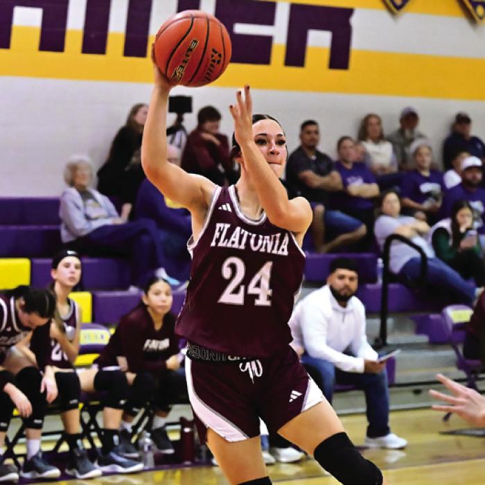 Jalee Trussell makes a pass to an open Lady Bulldog late in the second half of Friday night game in Shiner against the Lady Comanches. Photo by Stephanie Steinhauser