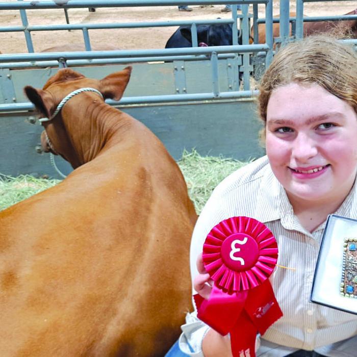 Rheagan Karisch placed second, fifth, and sixth with her heifers at the Emmons Ranch JBBA Cattle Show recently.