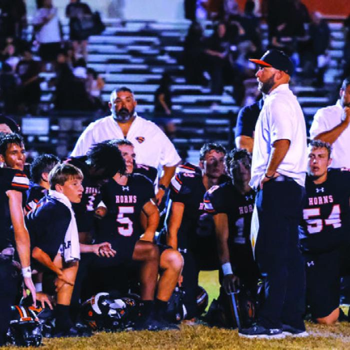 Schulenburg head coach Luke Hobbs talks to his players after their district win two weeks ago against Kenedy. Photo by Andy Behlen