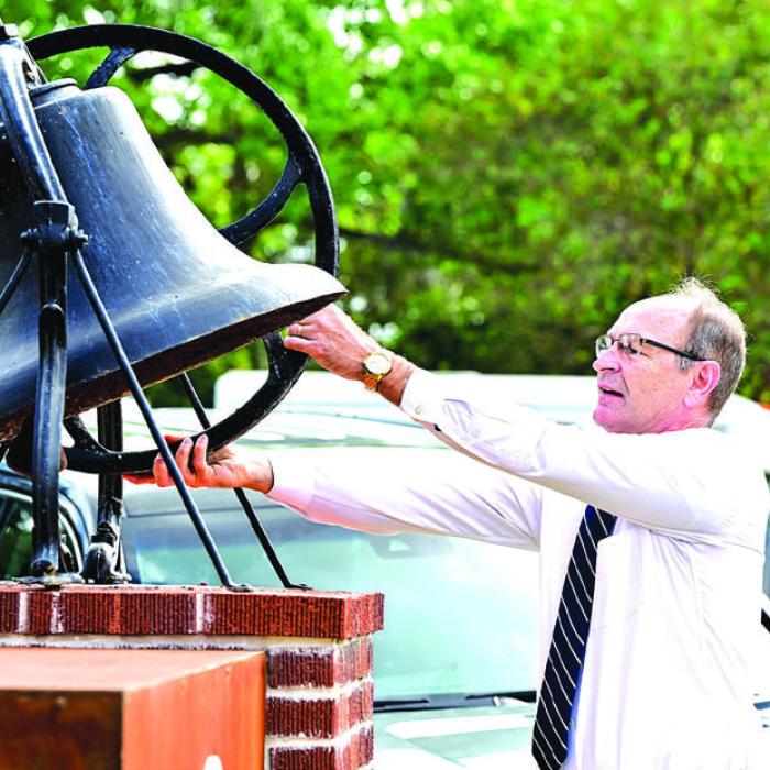 Judge and Deacon Jeff Steinhauser rings the church bell prior to Sunday’s church service. The bell is the last remaining item from the original church building. Photos by Stephanie Steinhauser