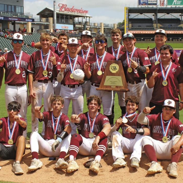 The members of the Fayetteville baseball team pose with their state championship medals and the state title trophy after winning Saturday’s 1A championship game 4-2 over Gordon. Photo by Jeff Wick