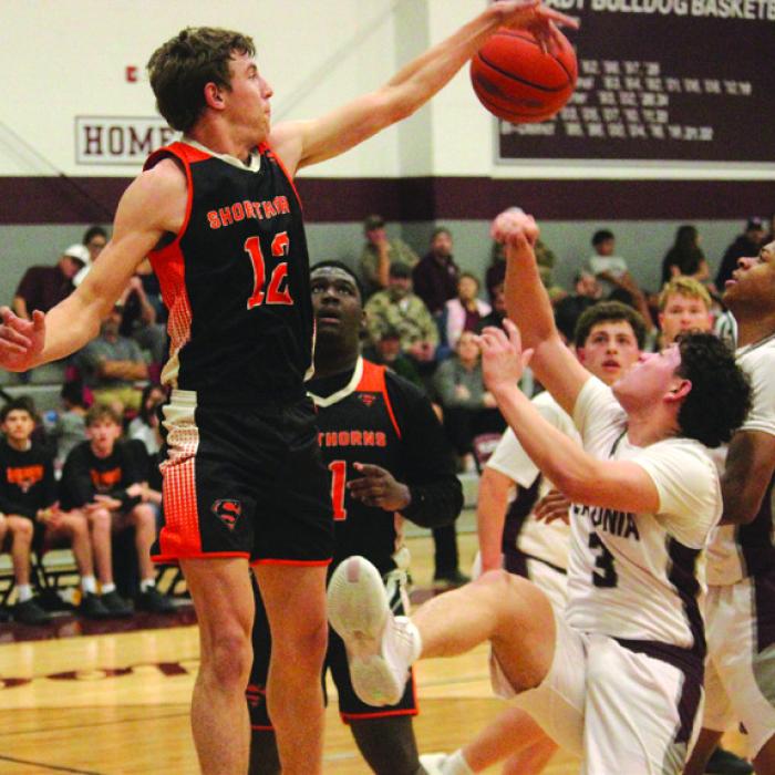Schulenburg’s Van Prihoda blocks a Flatonia shot in Friday’s game. Photo by Jeff Wick