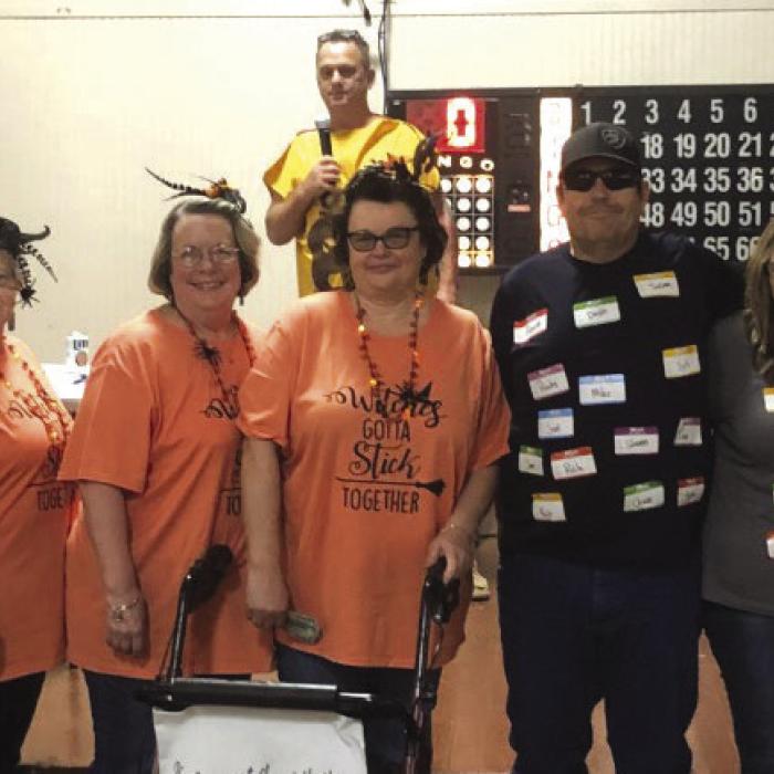 There was a tie for first place in the group category. Group 1 was Kim Vanek, Sherry Moore, Mollie Picket, Laurie Karisch, and Teresa Divin, and Group 2 was Sam Macklin, Ginni Macklin, Samantha Macklin, Trish Kubena, and Karyn Kubena.