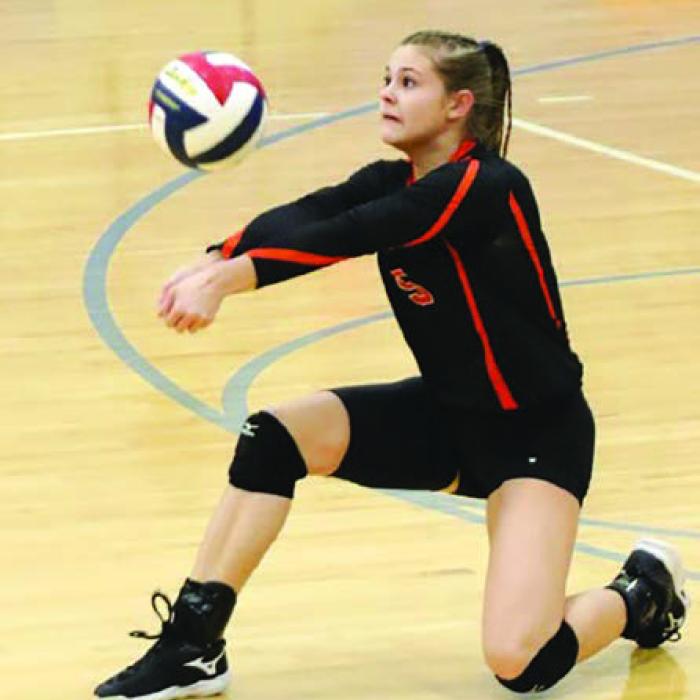 Schulenburg’s Michaela Kollman, left, and Haylee Vacek, right, pass the ball in Monday’s victory over Kenedy. Photo by Audrey Kristynik