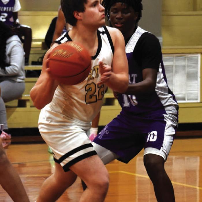 Round Top-Carmine’s Cash Robertson looks to make a pass in Friday’s victory over Calvert. Photo by Paul Kipp