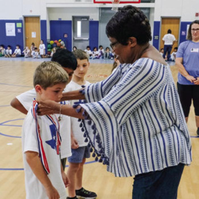 La Grange Mayor Jan Dockery awarded medals to the first, second and third place boys and girls.