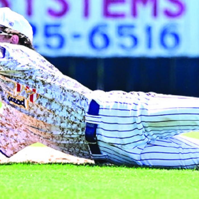 La Grange shortstop Tristan Ulrich makes the stop on a hard hit ground ball in Game 3 of the Bi-District playoff series with Sealy. Photo by Stephanie Steinhauser