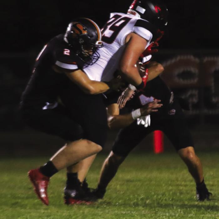 Schulenburg’s John Davis, left, and Jayse Janda, right, combine to make this tackle Friday. Photo by Audrey Kristynik