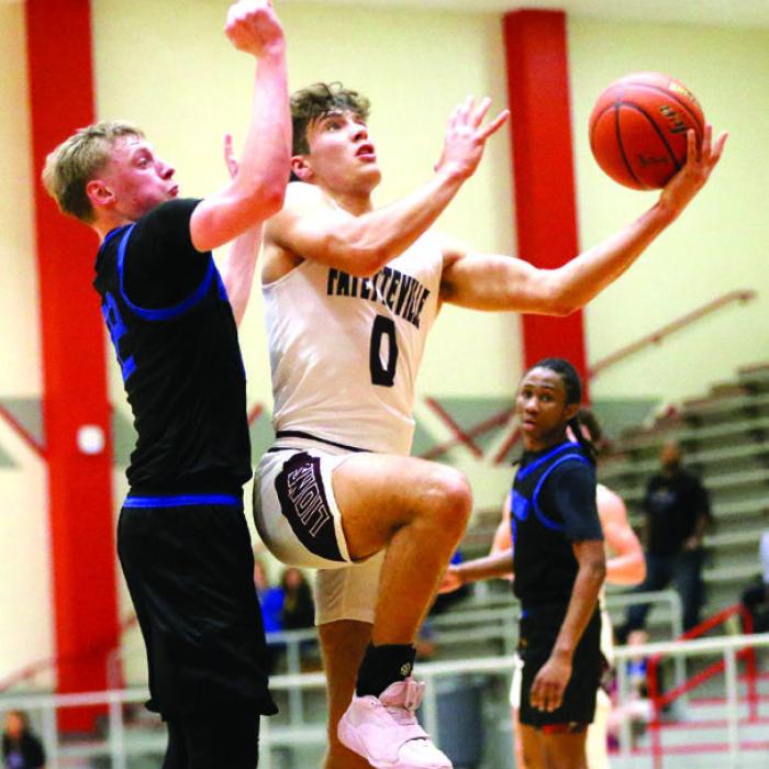 Fayetteville’s Enoch Loafman goes to the basket against some tight defense from Brookeland in Friday’s game. Photo by Ken Sury