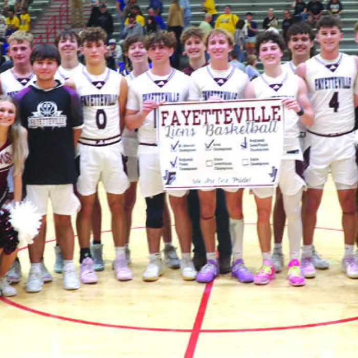 The Fayetteville players, staff, coaches and cheerleaders gather for a photo after the Lions’ regional final win over Brookeland. Photo by Ken Sury