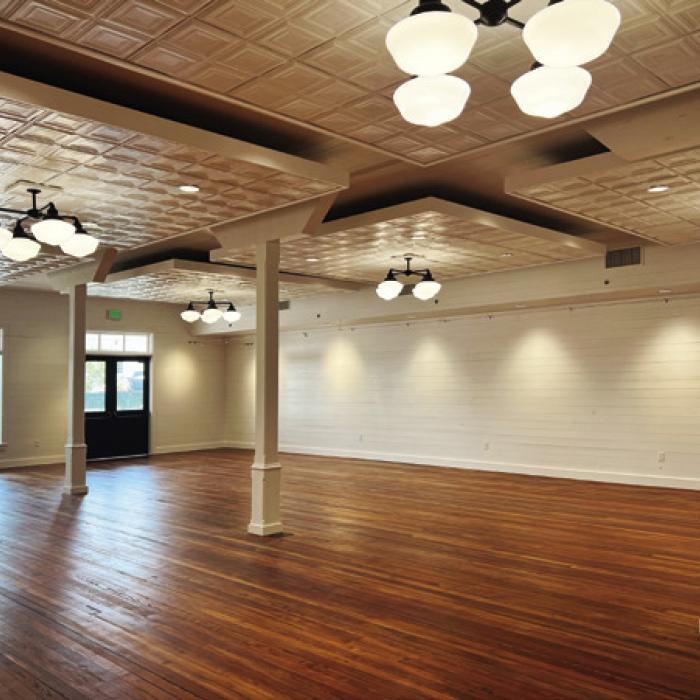 F&amp;R Wood Floors of Brenham installed, sanded and stained the reclaimed wood saved from the original E.J. Knesek floors. The columns on the first floor, shown here before being painted white, were also saved and reused.