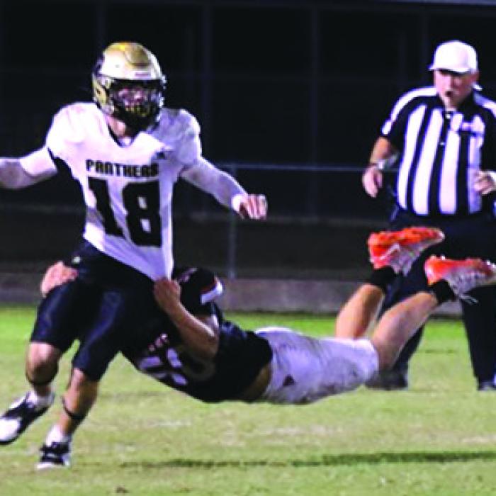 Schulenburg’s Preston Kahn with a diving tackle of Danbury’s QB. Photo by Audrey Kristynik