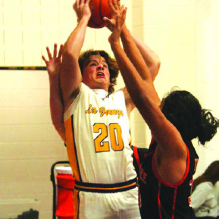 La Grange’s Christian Biles goes to the hoop in Friday’s game. Photo by Jeff Wick