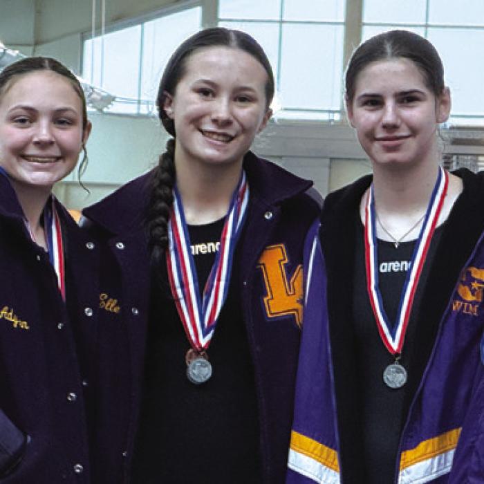 The girls 400 freestyle relay team of Adysen Janacek, Eleanor Carey, Makenna Emmel and Lillian Carey is advancing to regionals.