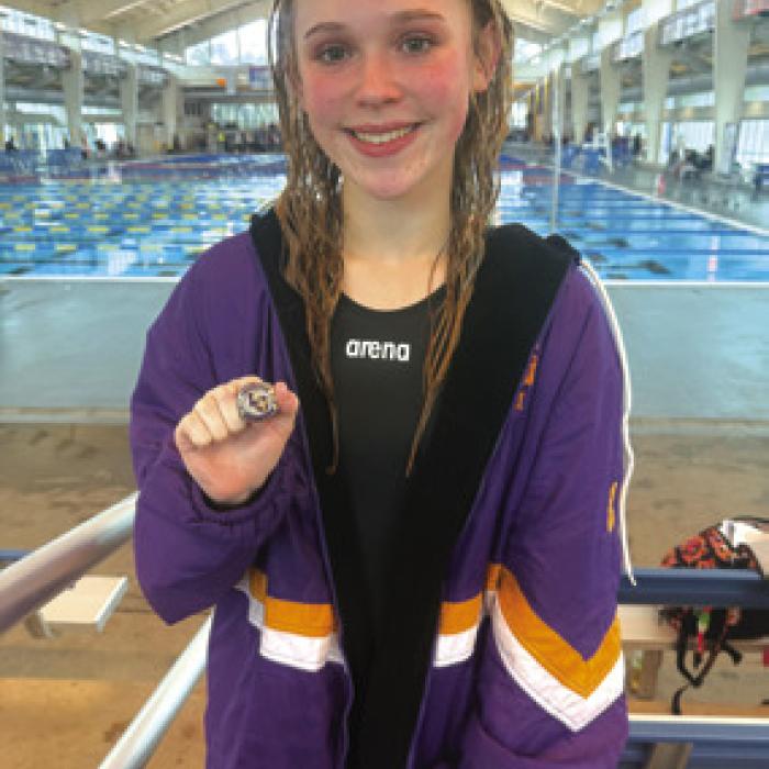 Lyria Hartley broke her own school record in the girls’ 100 backstroke, finishing fourth with a new mark of 1:16.02.