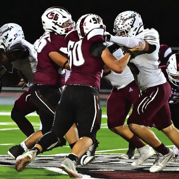 Flatonia’s defense works to slow down the Kenedy offense in Friday night’s district game.