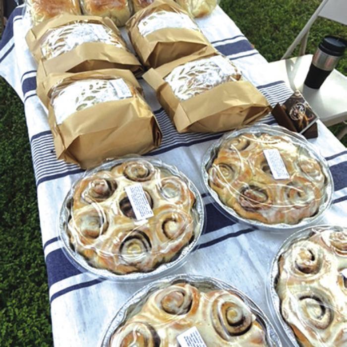 Paintings at the Farmers Market. Daily Kneads baked goods at the Farmers Market.