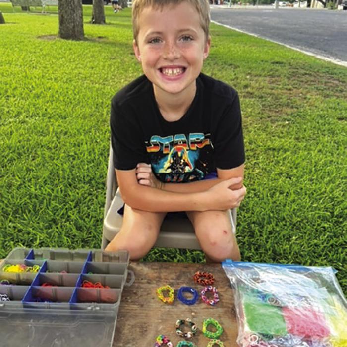 A young vendor at the Farmers Market.