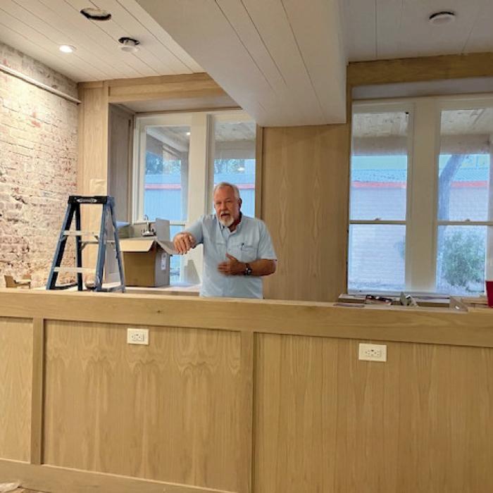General Contractor Carl Hoffman behind the newly constructed bar in the 1876 Bar at the Grand Fayette.